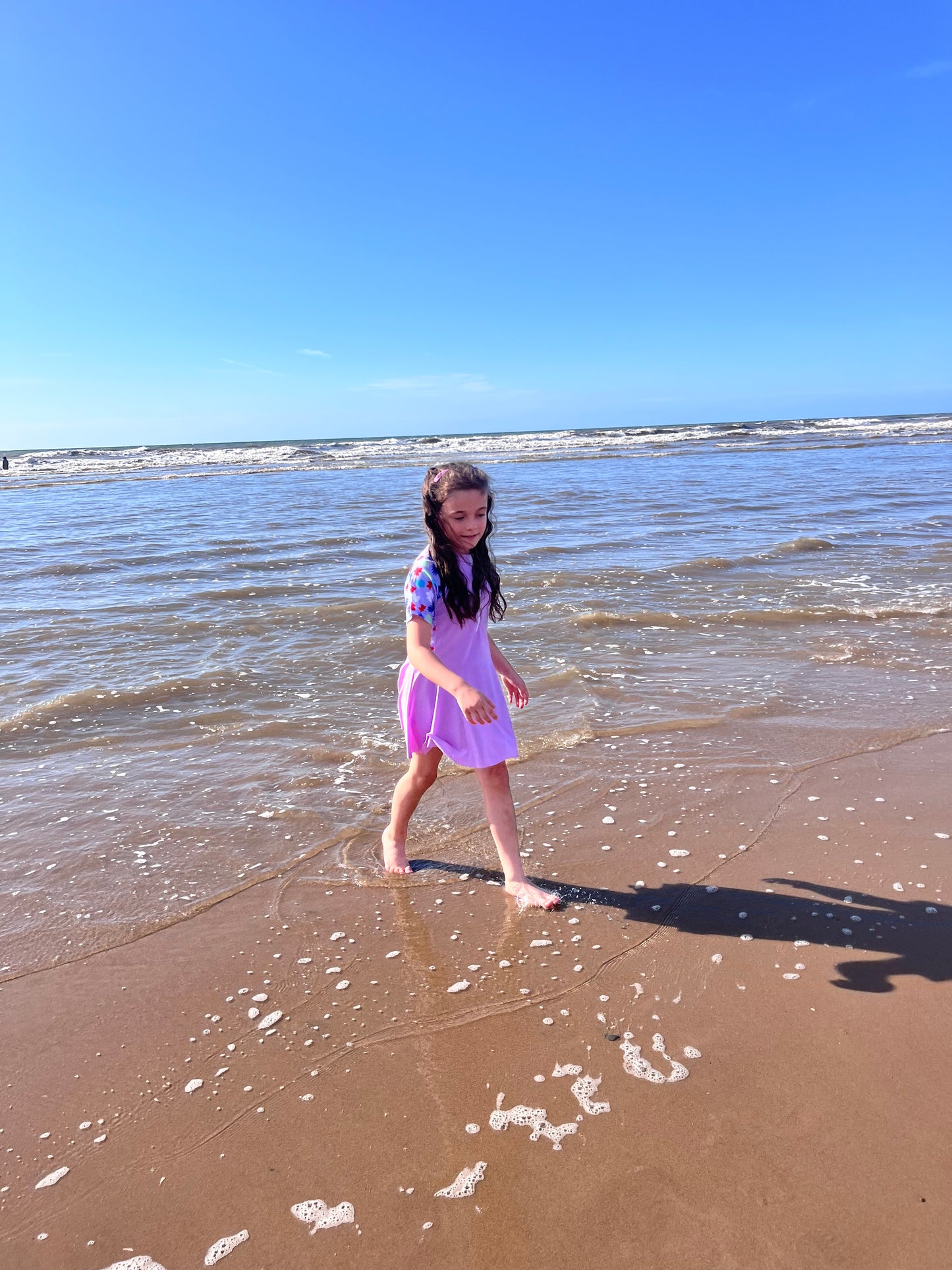 Girls purple swimming dress and shorts set.