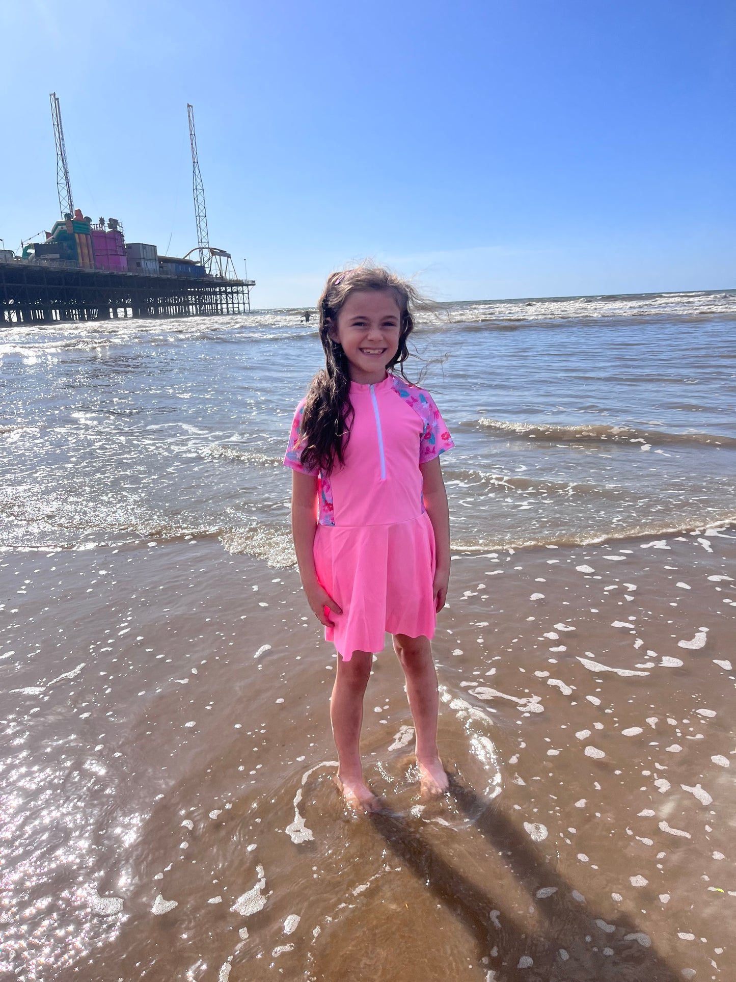 Girls pink swimming dress and shorts set.
