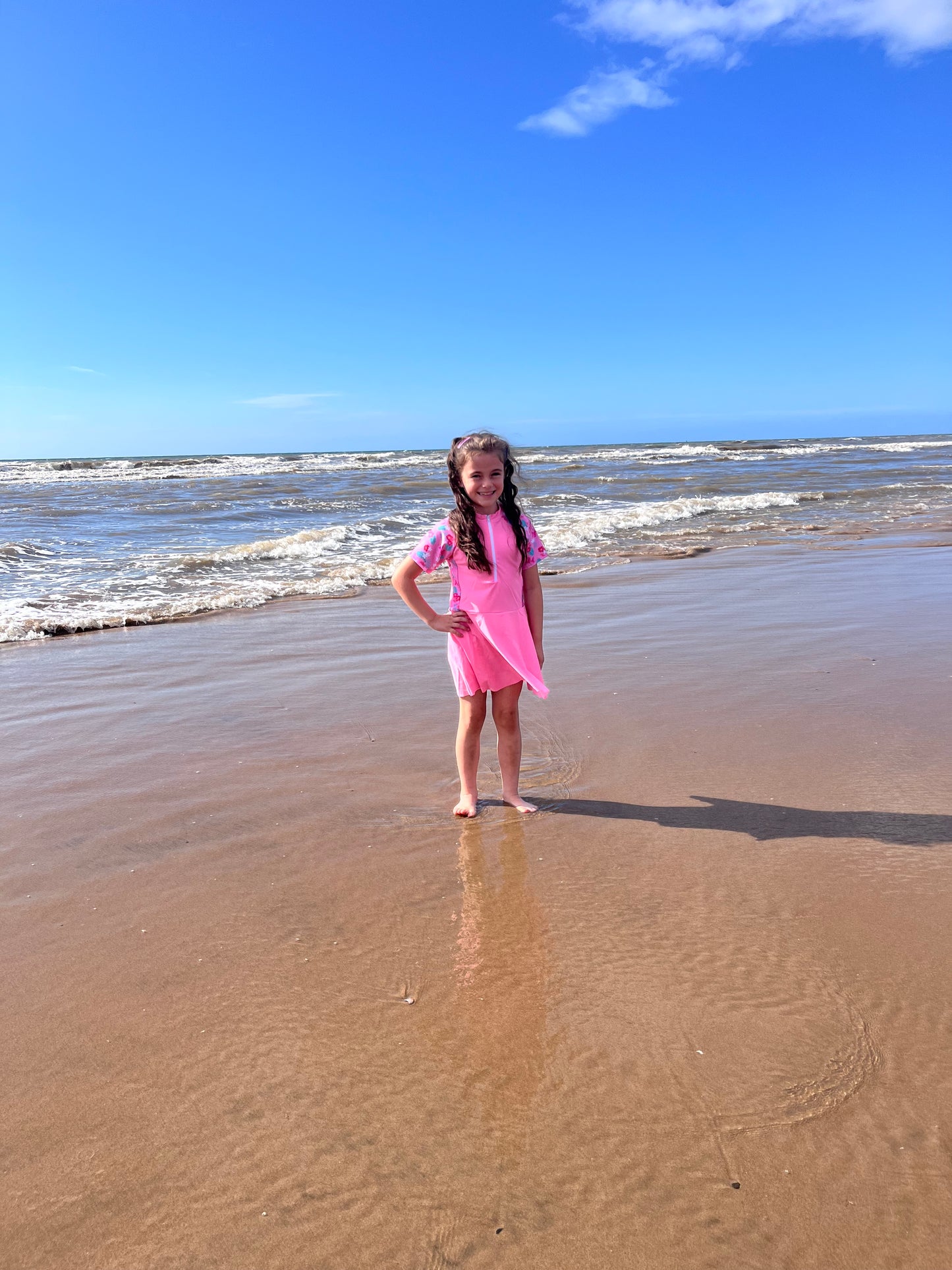 Girls pink swimming dress and shorts set.