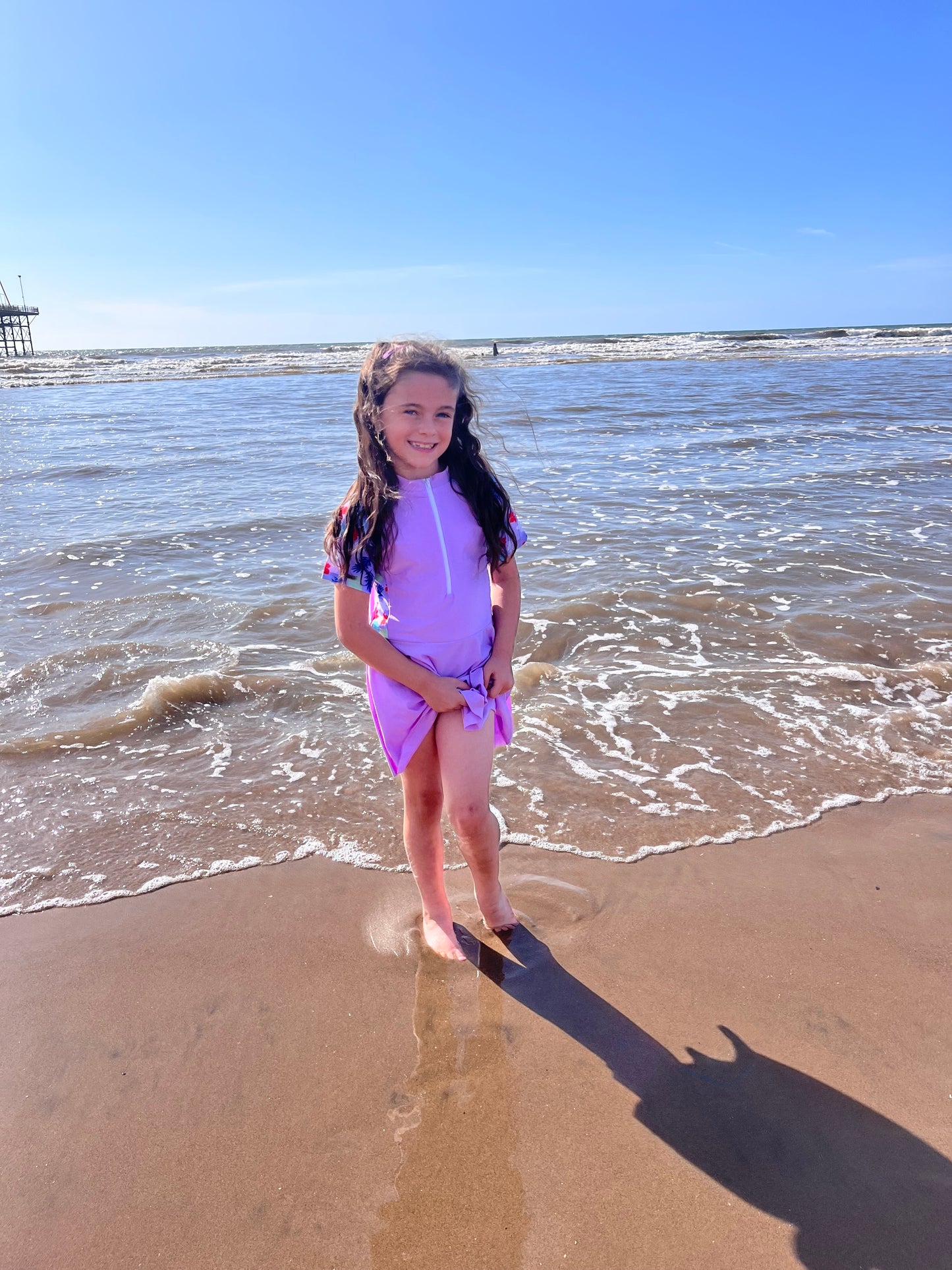 Girls purple swimming dress and shorts set.