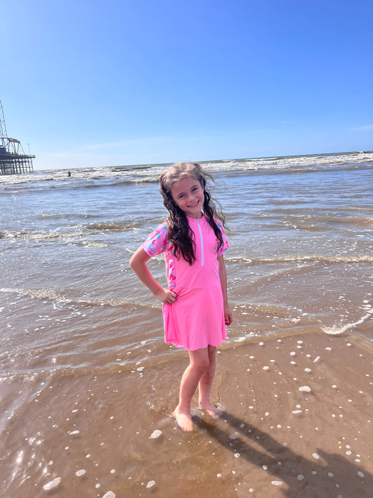 Girls pink swimming dress and shorts set.